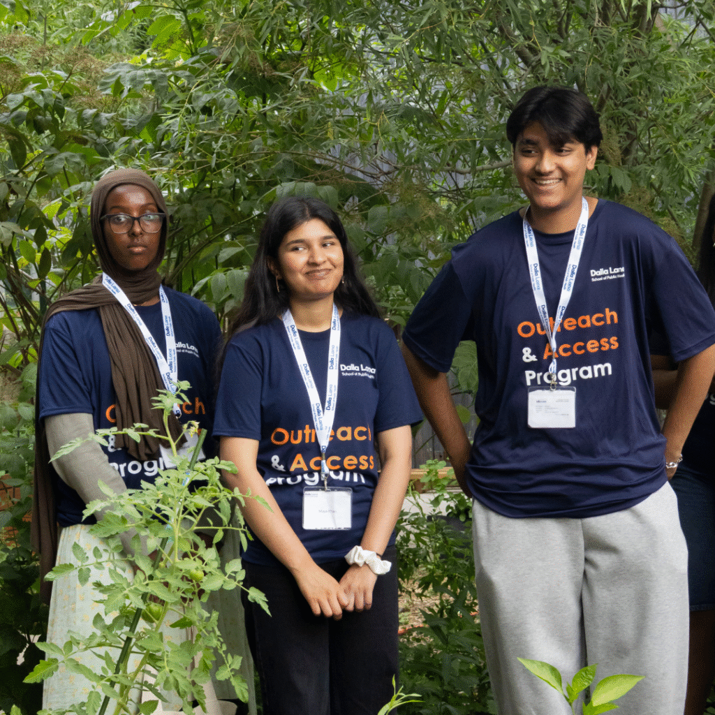 Students from the Dalla Lana School learning about food insecurity in urban settings, at The Stop's shelter garden.